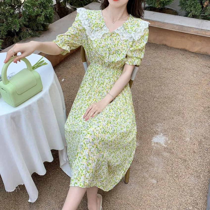 Elegant A-line Dress Featuring Pleats and a Floral Design